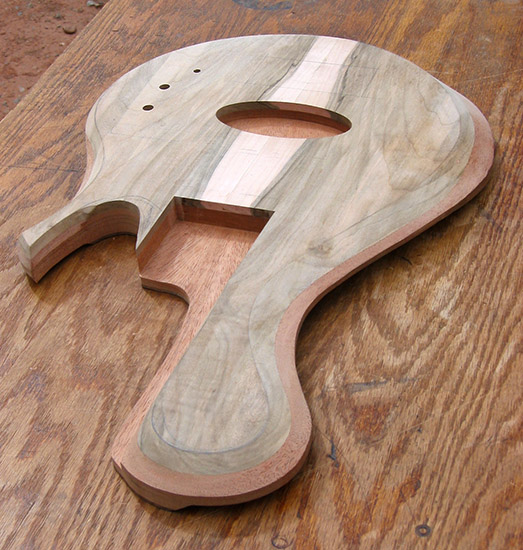 5 string custom bass body with single-cutaway shape, carved