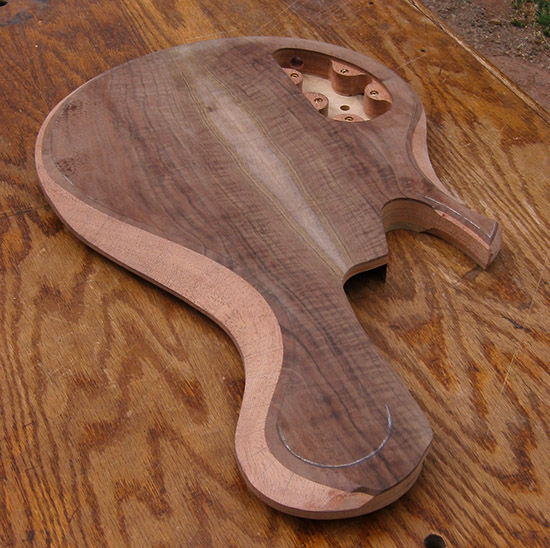 5 string, single-cut bass body, carved body bevel