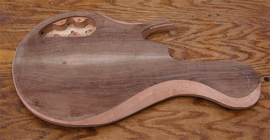 5 string bass body with claro walnut and mahogany carved bevels