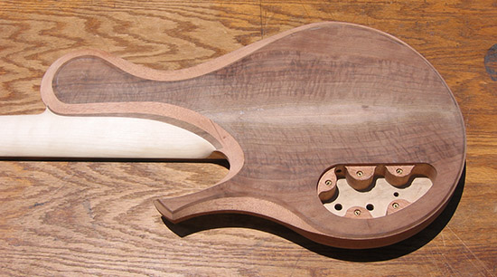 Single-cut bass with Claro walnut top, back