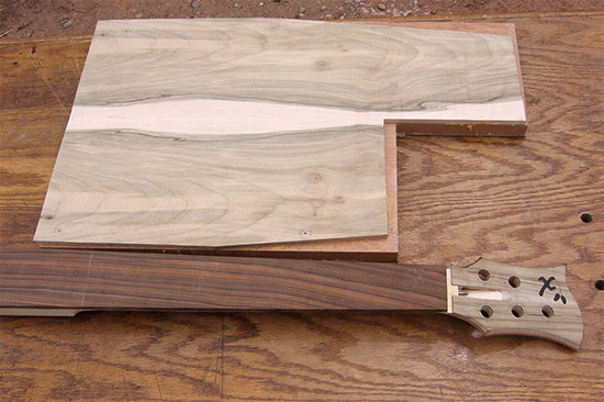 Fretless custom bass neck and mahogany/spalted maple body blank