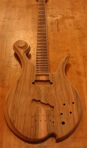 Custom bass with book matched spalted maple top and fretted bocote fretboard