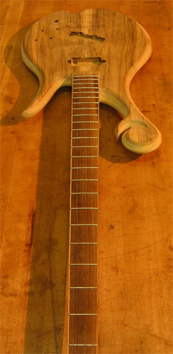 Xylem custom bass with frets in its bocote fretboard