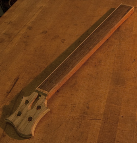 Custom bass with a bocote fretboard and spalted maple binding