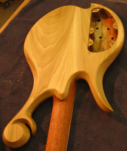 Poplar back of a 4 string custom bass with Xylem scroll