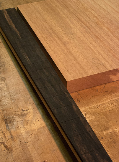 Ebony neck of a sub-contra bass guitar