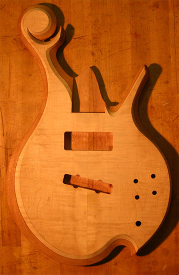 Flamed maple and mahogany bass after carving