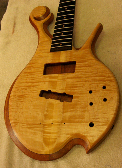 Curly maple top on a Xylem custom bass