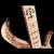 Custom inlays of Nordic runes and Yggdrasil in a bass guitar