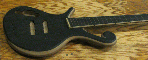 The bass' ebony top and maple-lined finger board after the neck was glued into the body