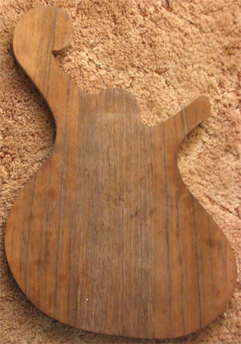 The cutout of the bass body from the rear