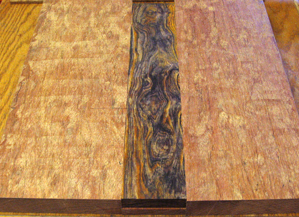 The rough planed guitar body blank from the front showing beautiful cocobolo grain pattern
