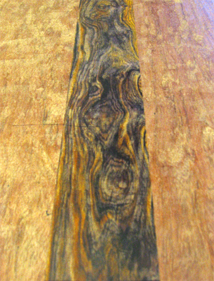 A close-up of the cocobolo center piece of the body
