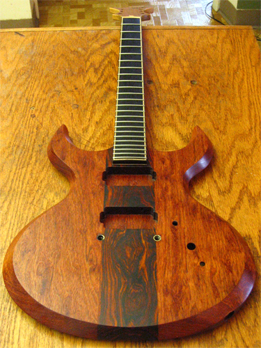 The custom guitar recently fretted and newly coated with oil finish