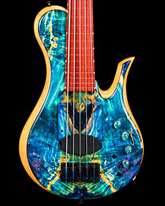 Fretless bass with blue stabilized burl top and radius ramp