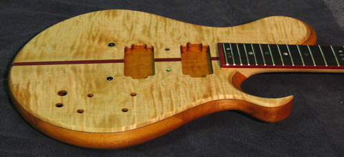 Xylem custom guitar's side showing set neck joint and abalone fingerboard inlays