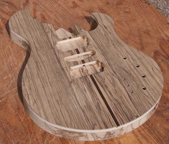 Black limba custom guitar body with maple, cocobolo accents