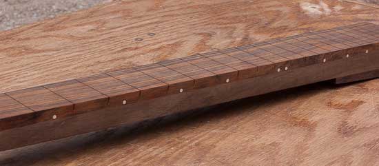 Maple dot markers on a custom guitar neck