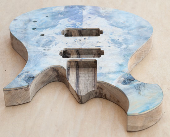 Exotic custom guitar with black limba body and buckeye burl top