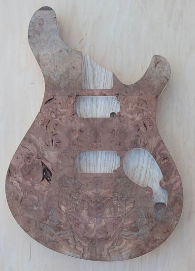 Electric guitar body with maple burl top, ash core