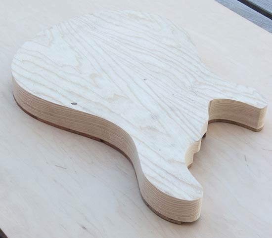 Swamp ash custom guitar body with burl topwood