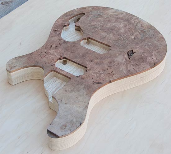 Red maple burl topwood on swamp ash guitar body