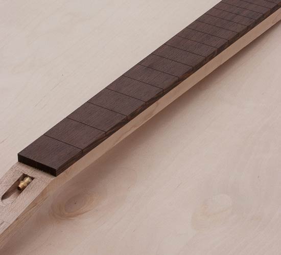 Maple/wenge guitar neck before headstock ears are attached to headstock