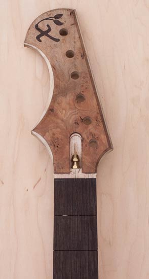 Guitar headstock with reverse-inline tuners
