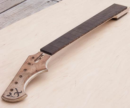 Custom guitar neck with Xylem logo, wenge fretboard