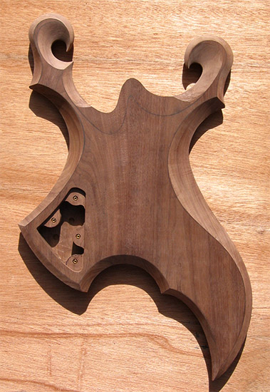 Black walnut metal style guitar body with carved bevels