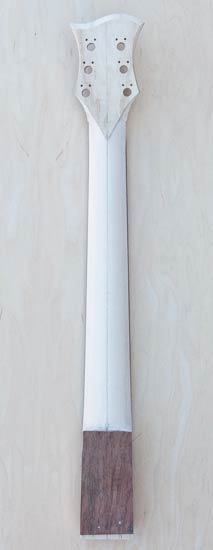 Maple guitar neck with carved profile, ash headstock veneer