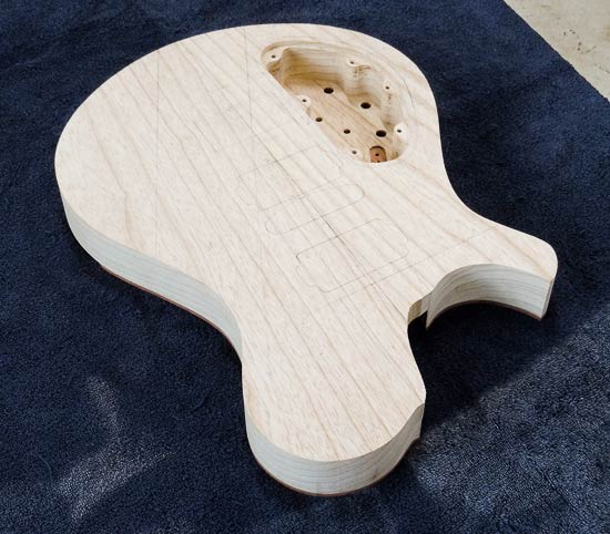 Swamp ash electric guitar body during the building process