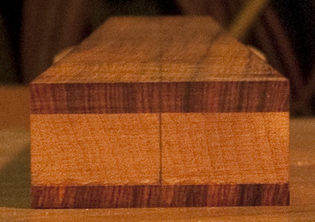 Xylem bass neck heel with quarter sawn mahogany core and cocobolo fret board