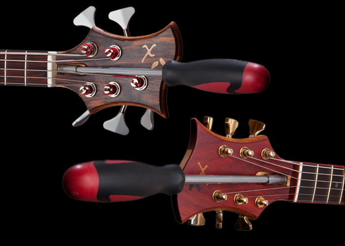 A custom bass and custom guitar with easy truss rod access
